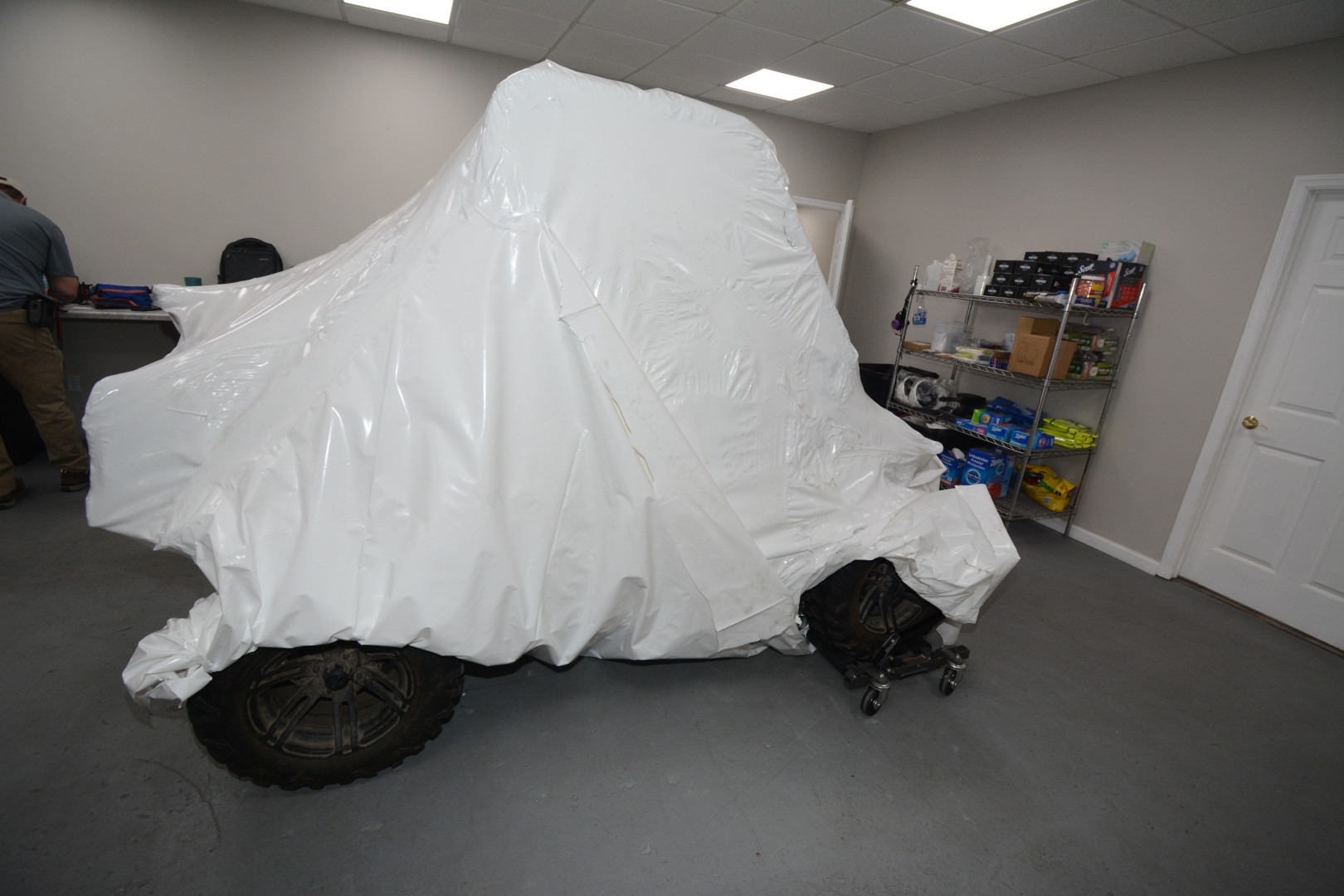 Burned golf cart wrapped inside lab